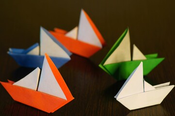 A group of colorful paper boats.