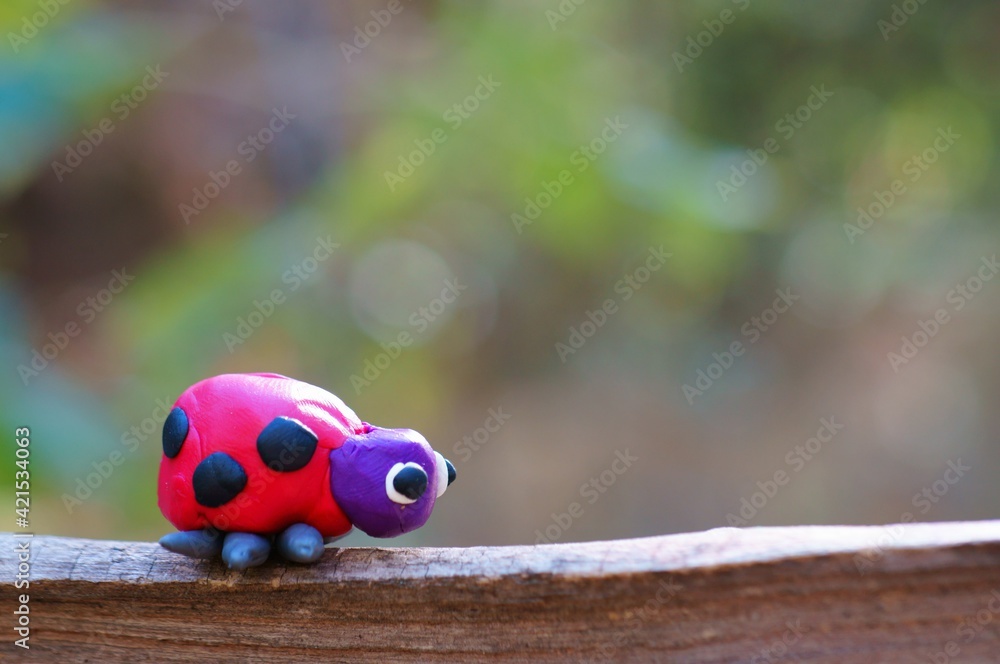 Poster Figurine of a ladybug made of plasticine.