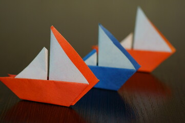 A group of colorful paper boats.