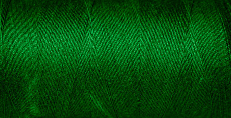 green cotton threads with visible details. background