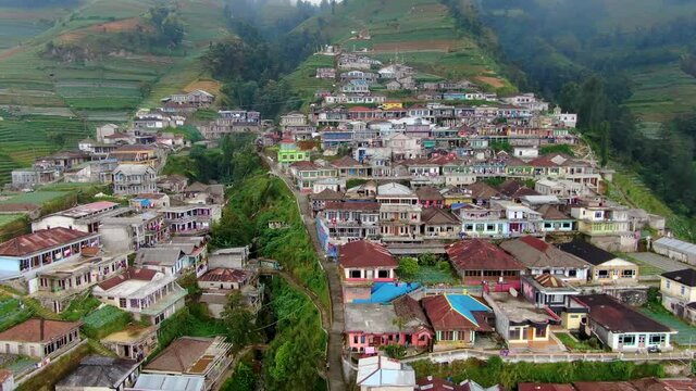 Tropical village simple houses on Mount Sumbing volcano slope, Java, aerial