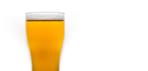 Close-up of a glass of light beer on a white background with copy space. Banner