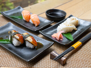 Fototapeta na wymiar Japanese Menu - Variety of Japanese sushi on the table