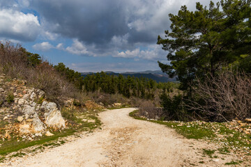 Landscape, rural road and green hills.