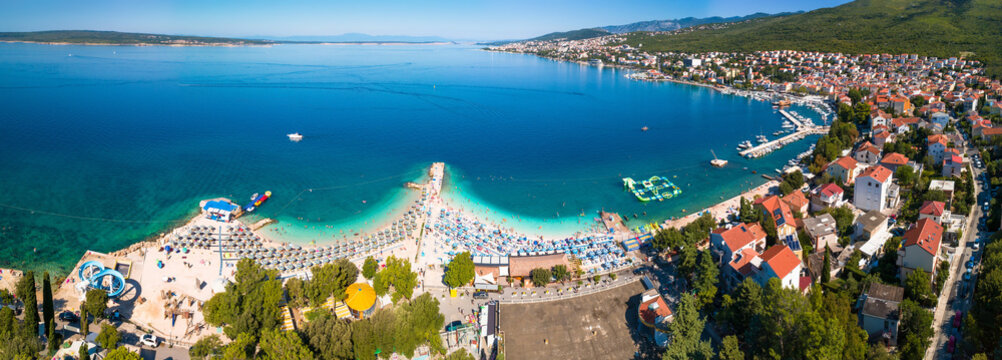 Tourist town of Selce and Poli Mora turquoise beach aerial panoramic view