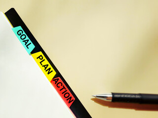 Inspirational and motivational concept - GOAL PLAN ACTION text with vintage background. Stock photo.