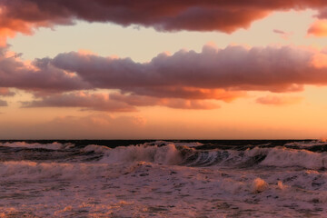 Cloudy sunset at the stormy sea.