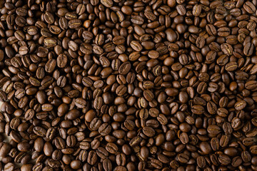 Roasted coffee beans background, brown color, top view