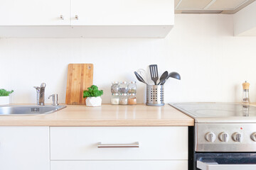 Scandinavian classic minimalistic kitchen with white and wooden details. Modern white kitchen clean contemporary style interior design.