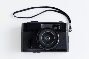 Old classic retro black film camera on white background