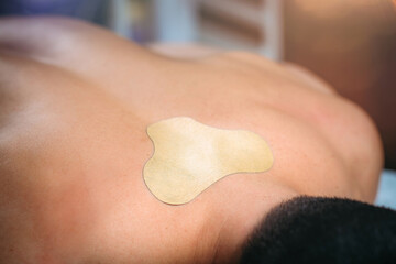 Fototapeta premium Herbal Pain Relief Plaster, Calming Trapezius Muscle Pain.