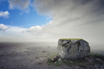 Beautiful ground background with big rock mist and clouds