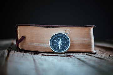 compass with Holy Bible