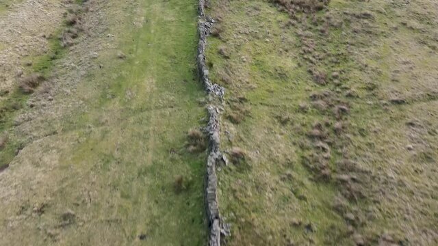 Drone Fly Over Aerial View countryside farmland walls Peak District Holmfirth West Yorkshire