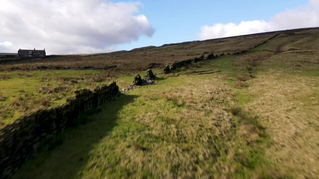 Drone Fly Over Aerial View countryside farmland walls Peak District Holmfirth West Yorkshire
