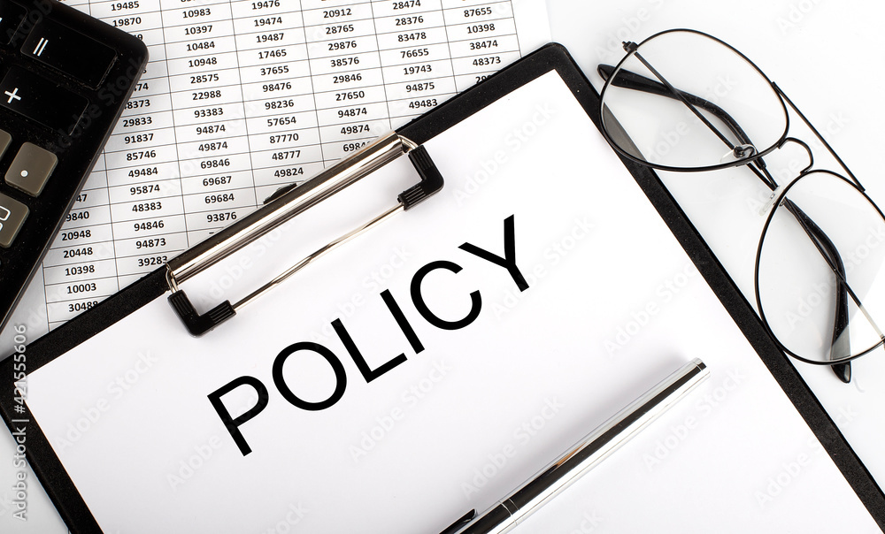 Poster paper with text policy on the table on the chart