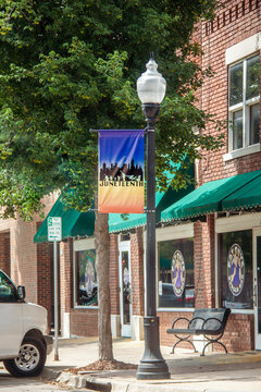 07-02-2020 Tulsa USA Juneteenth Sign On Lamppost Along Greenwood Avenue In Historic Black Wallstreet District - Brick Buildings And Tree Lined