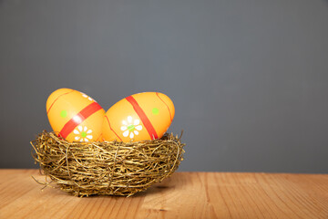 Golden easter colour eggs in golden basket .Happy Easter decoration. Spring holiday concept