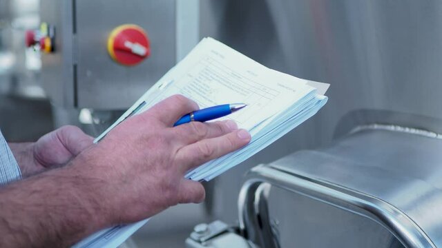 Quality manager, engineer check machine equipment. Inspection and checking work in the industry factory. Scene B