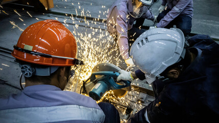Worker are grinding metal steel, Electricity spark from chainsaw, Technician are cutting pipe, Risk...