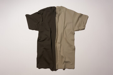Two t-shirts lying on a white background