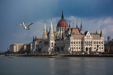 Fototapeta na wymiar Hungary Budapest, Parliament against the background of the dramatic sky, reflected in the water