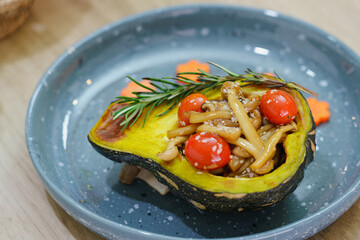 Roasting butternut squash pumpkin with mushrooms and tomato rosemary delicious clean food.