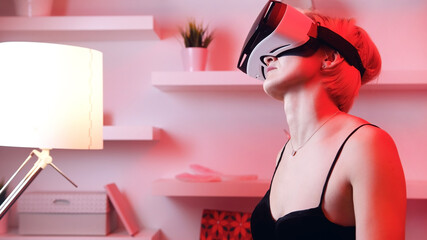 Young woman using VR glasses. Virtual dating. High quality photo