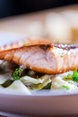 Pasta with roasted salmon in  sour cream leeks and dill. Fresh home made pasta. Delicious dish. beautifull fried salmon on top of home made pasta. Italian dish. Fine dining. Beautiful ingredients. 
