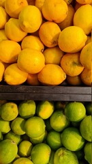 lemon and lime in yellow and green in market