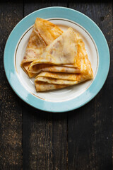 crepes breakfast thin pancakes sweet dessert flat cake Shrovetide snack healthy meal top view copy space for text food background rustic
