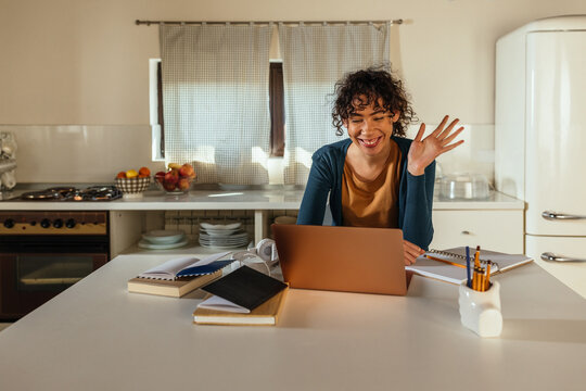 Black teenage girl having online class at home