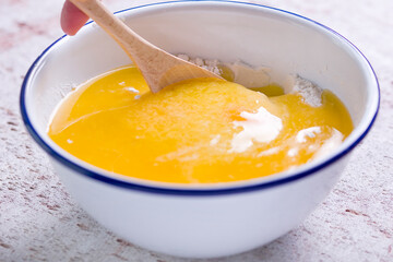 Making a shortcrust pastry adding melted butter to the flour