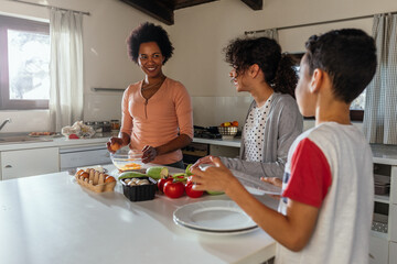 Hispanic family cooking together