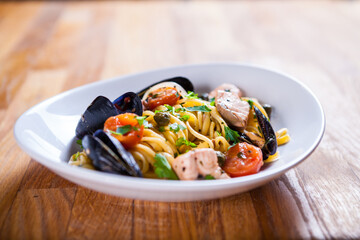 Pasta with seafood. Pasta with mussels and basil. Fresh Seafood fresh homemade pasta with mussels and parsley. Fresh Italian food. Mediterranean fresh sea food dish. Beautiful plate. fine dish