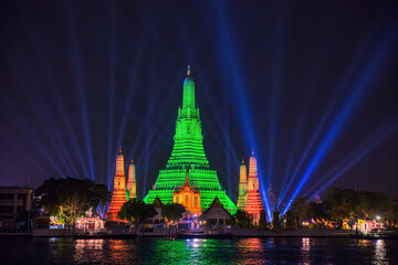 Naklejka premium Wat Arun in green to celebrate St. Patrick's Day 2021, Bangkok Thailand
