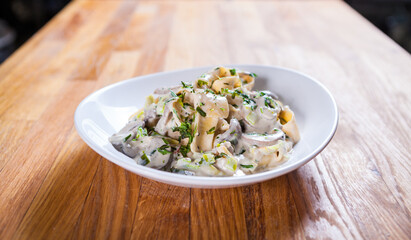 Tagliatelle pasta with asparagus mushrooms and basil in sour cream sauce. Italian pasta. fresh pasta 
culinary recipe