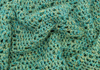 crochet thread blue green and yellow texture background copy space