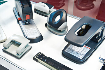 Stationery staplers and hole punches on shop