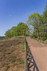 Fototapeta na wymiar Path going up to the lion statue on the Lemelerberg hill in Overijssel, Netherlands