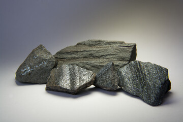 Iron ore or hematite rocks isolated. These minerals are used in metallurgical industries as raw materials to produce steel and other products.