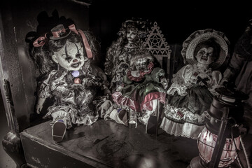 Scary dead dolls are on the shelf. Zombie dolls.