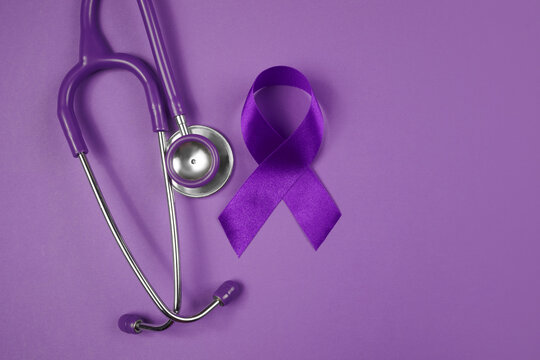 Purple day. World epilepsy day. Purple ribbon on purple background