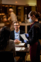 Qualified woman a cafe table with two s