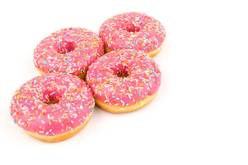 Fresh made Donuts isolated on white background. Doughnuts are traditional sweet pastries. Copy space for text.