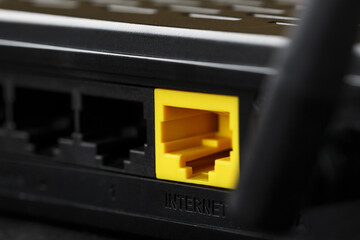 Yellow Internet connector for connection to the network, Wi-Fi router for Internet access