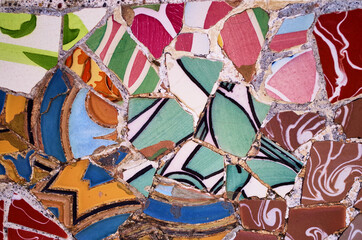 Broken glass mosaic tile, decoration in the Park Guell, Barcelona, Spain