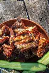 grilled pork ribs on a clay plate