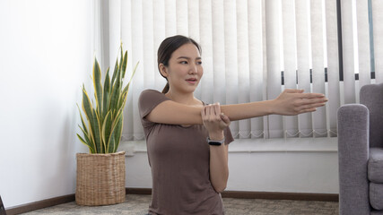 Slim fit Asian woman  Internet coach yoga and meditation coaching videos make them feel relaxed,...