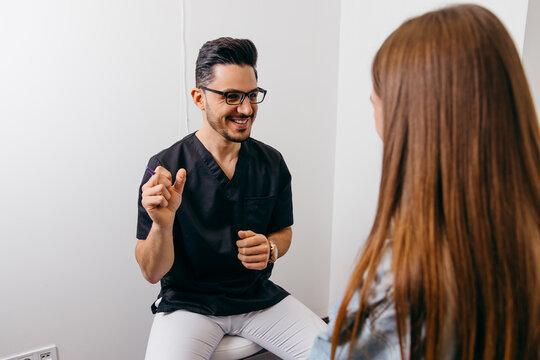 Young woman patient have consultation with doctor before exam